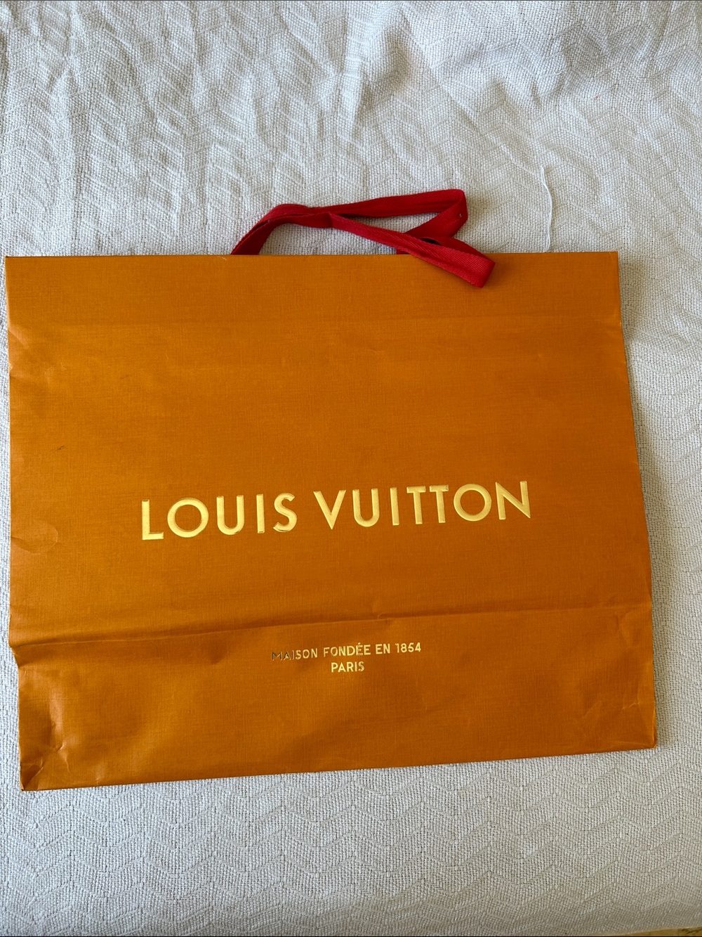 Louis Vuitton Orange paper Bag with Red cloth Handles